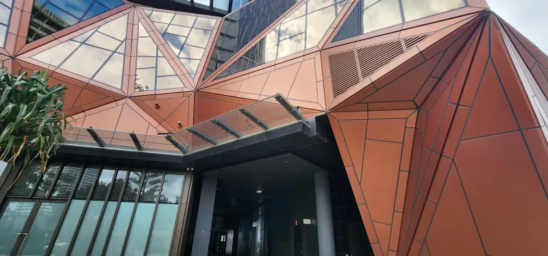 The Langham: the bronze faceted entrance canopy, wide view